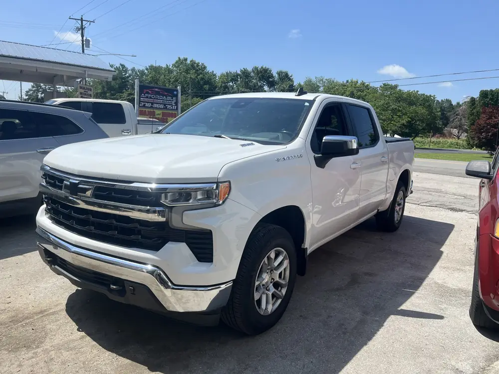 White Chevrolet Silverado pickup parked at the shop