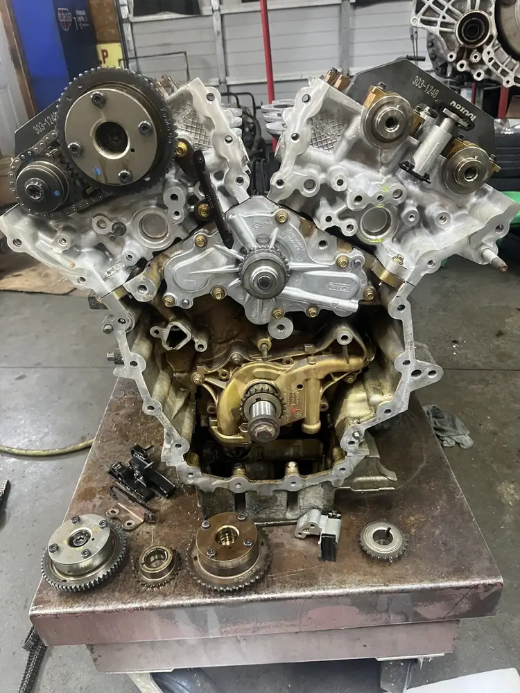 V6 engine torn down to the timing components on a work stand