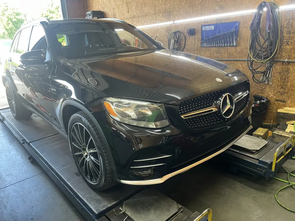 Black Mercedes-Benz GLC on the alignment rack