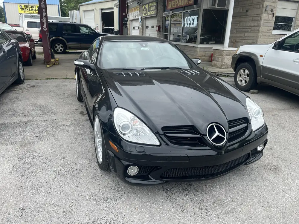 Black Mercedes-Benz SLK roadster in the lot