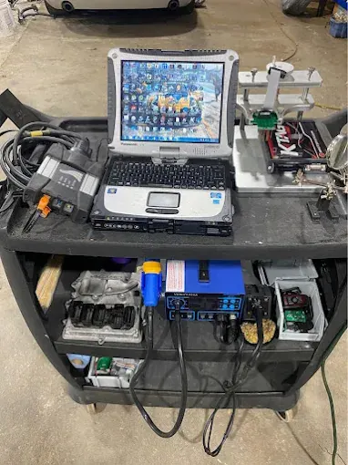 Diagnostic cart with a rugged laptop, scan tool interface, and electronics bench equipment